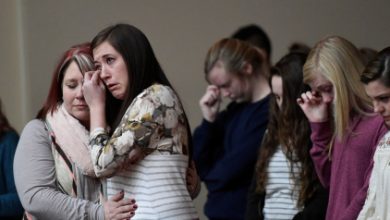 Students attend a prayer vigil for students killed and injured after a 15-year-old boy opened fire with a handgun at Marshall County High School, at Life in Christ Church in Marion, Kentucky