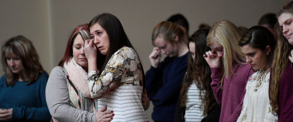 Students attend a prayer vigil for students killed and injured after a 15-year-old boy opened fire with a handgun at Marshall County High School, at Life in Christ Church in Marion, Kentucky