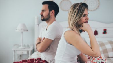 Couple having arguments and sexual problems in bed