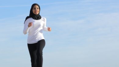 Arab saudi emirates woman running on the beach