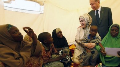 Recep Tayyip Erdogan and Emine Erdogan visit a camp for displaced people in Mogadishu