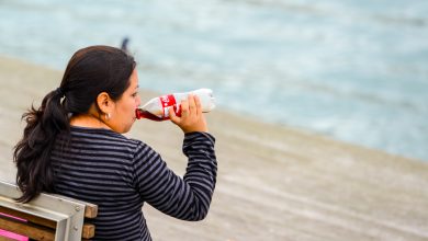 Mature Woman Drinking Coca-Cola