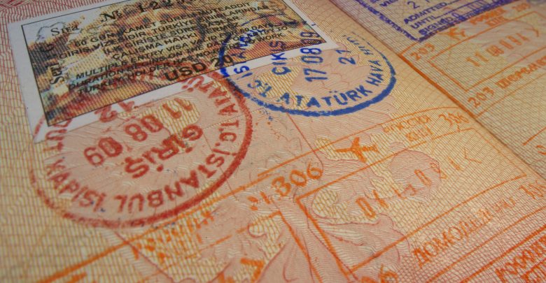 Passport page with Turkey visa and immigration control stamps.